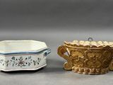 pair of small porcelain dishes with handles and handles in the shape of flowers