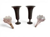 three vases that are sitting next to each other on a table