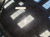 sunlight shining through the windows of a large dome in a building