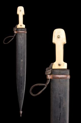pair of knifes on a black background with a black background