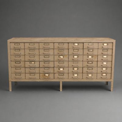 a wooden cabinet with drawers and drawers on top of it