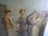 un tableau représentant trois femmes jouant d'instruments de musique dans une pièce