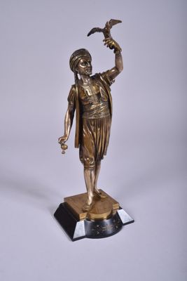 bronze statue of a woman holding a bird on top of a marble base