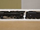a toy train sitting in a box on a table