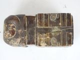 a wooden object that is sitting on a white surface