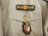 a badge on the back of a man ' s uniform