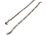 a close up of a silver chain on a white background