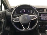 the interior of a car with a steering wheel and dashboard controls