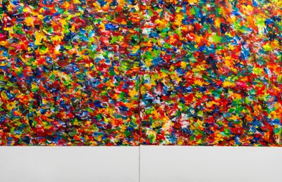 a large painting on the wall next to a couch