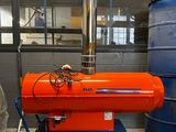 an orange proprigerator sitting on a cart in a room