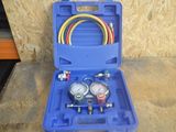 an image of a blue case with a couple of gauges in it