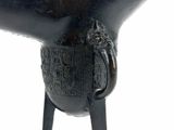a statue of an elephant with a handle on it ' s leg