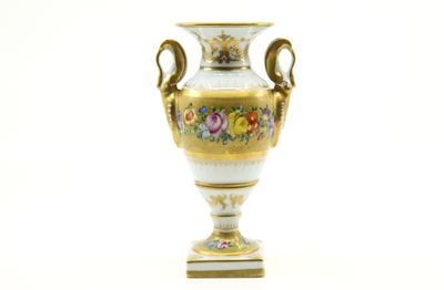 a vase that is sitting on a white surface