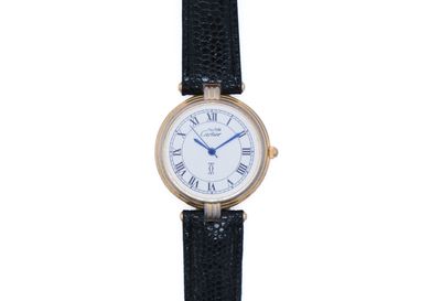 a close up of a wrist watch with roman numerals on it