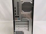 a silver computer on a white surface with a white background