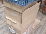boxes stacked on top of each other on the floor in a living room