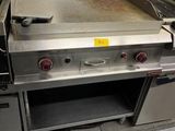 an image of a commercial kitchen with stainless steel appliances