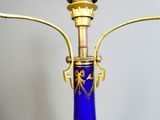 an image of a blue vase with a gold handle