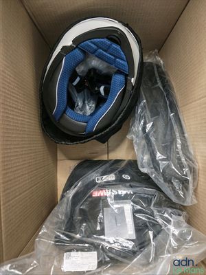 a box with a helmet and other items inside of it