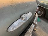 a close up of a car ' s emblem on the front of it