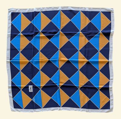 a blue, orange and yellow square scarf on a white background
