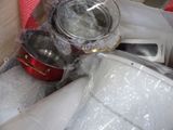 many pots and pans that are in a box
