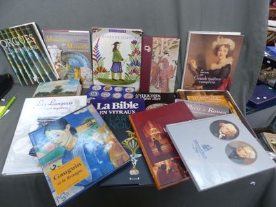 a lot of books on a table that are sitting on a table