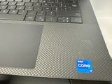 a close up of a laptop with a core logo on the keyboard