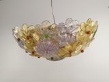 a glass bowl hanging from the ceiling in a room