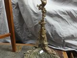 a statue of a cross on a rock on a table