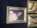 three framed pictures of a woman laying on a bed in a room