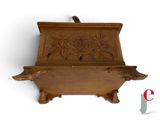 a wooden box that has a bird on it