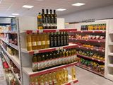 a store with a lot of bottles of wine on the shelves