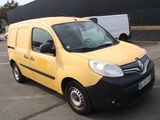 a small yellow van parked in a parking lot