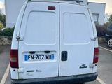 a white van that is parked in a parking lot