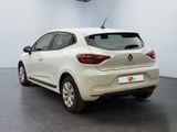 the rear end of a white car parked in a garage