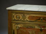 a marble top chest of drawers with a marble top