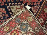 several different rugs are arranged on the floor in a room