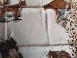 a picture of a table cloth with a picture of a fox and other animals