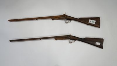a pair of winchester rifles,