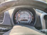steering wheel of a car with a speedometer and gauge