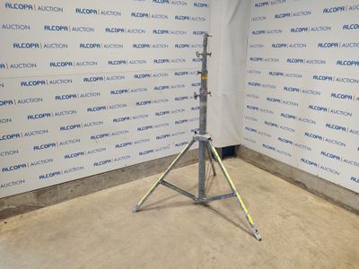 an image of a tripod stands in front of a wall with a sign