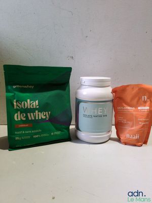 two packets of whey and a bag of whey sitting on a counter
