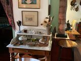 a picture of a room with a table and a chair