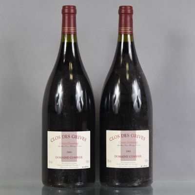 two bottles of red wine sitting on top of a glass table