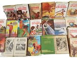 a lot of books that are sitting on a table