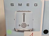 two boxes with a toaster sitting on top of each other
