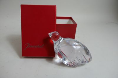 a red box with a glass perfume bottle in it