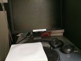 a stack of books and a computer mouse on a desk