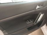 the interior of a car with the door open and a remote control in it